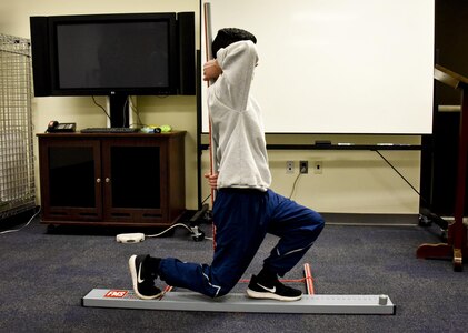A 70th Intelligence, Surveillance and Reconnaissance Wing Airman conducts an inline lounge Jan. 25 at Fort George G. Meade, Maryland. The inline lounge is one of the seven movement assessments of the Functional Movement Screen, which is part of the Meeting Mission Objectives via Exercises (MOVE) program. FMS uses seven different assessments to identify weak and improper movement patterns. The seven exercises are the deep squat, hurdle step, inline lounge, shoulder mobility, active straight leg raise, trunk stability and rotary stability. (U.S. Air Force photo/Staff Sgt. AJ Hyatt)