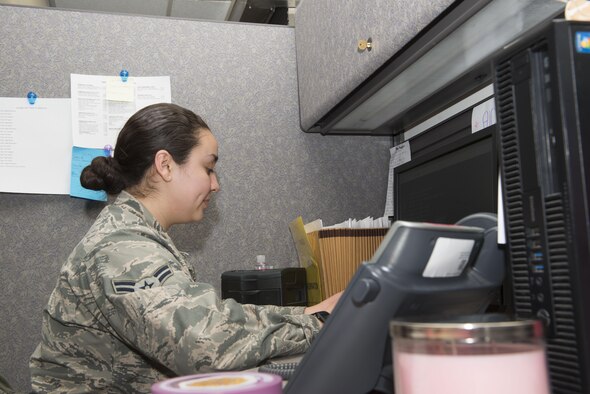 Airman 1st Class Karla Vasquez, 366 Medical Support Squadron health service management technitian, enters patient information into the computer January 12, 2016, at Mountain Home Air Force Base, Idaho. After talking with her father, Vasquez decided to join the military to continue her education. (U.S. Air Force photo by Senior Airman Malissa Lott/Released)