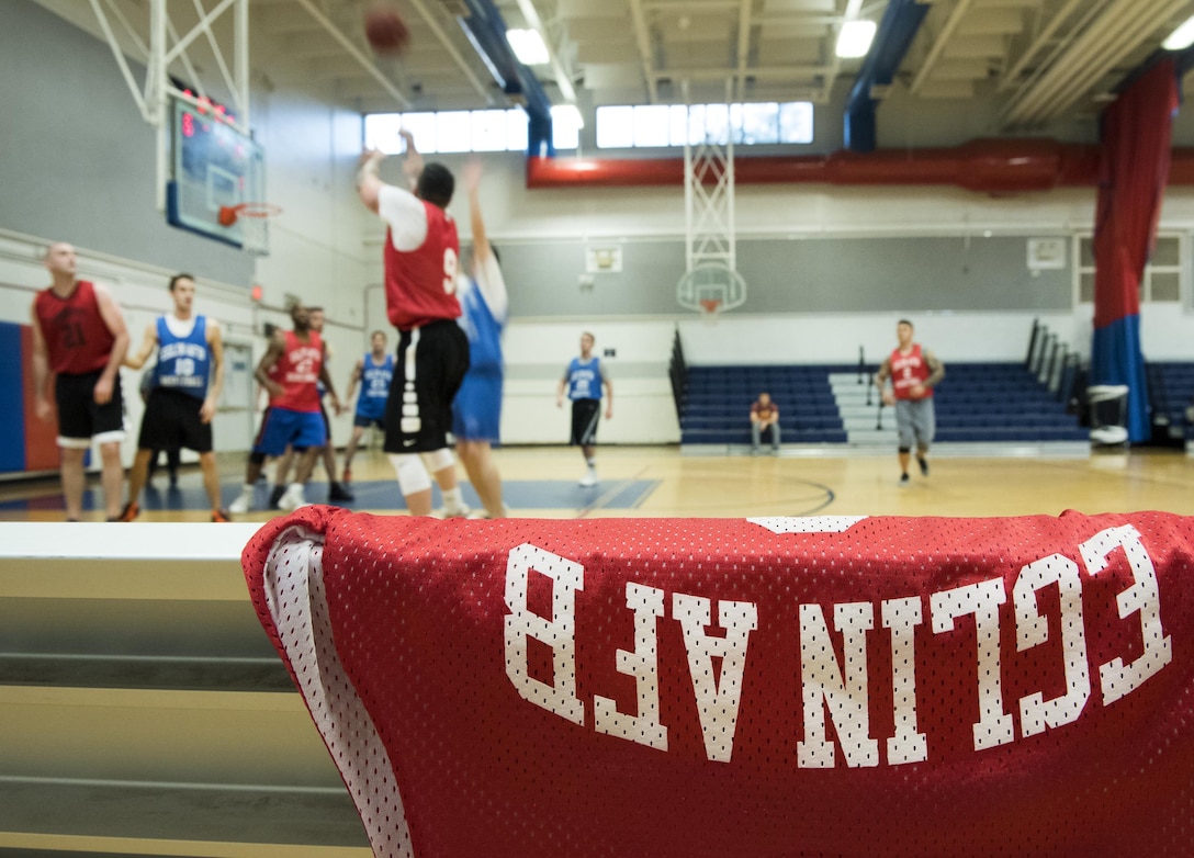 The 592nd Special Operations Maintenance Squadron’s Eric Otero takes a three point shot during the first half of their intramural basketball game Jan. 24 at Eglin Air Force Base Fla.  The maintainers easily controlled the game using their height advantage over the Air Force Research Lab team.  The Duke Field-stationed team rolled to a 2-0 season start with the 41 – 32 victory.  (U.S. Air Force photo/Samuel King Jr.)