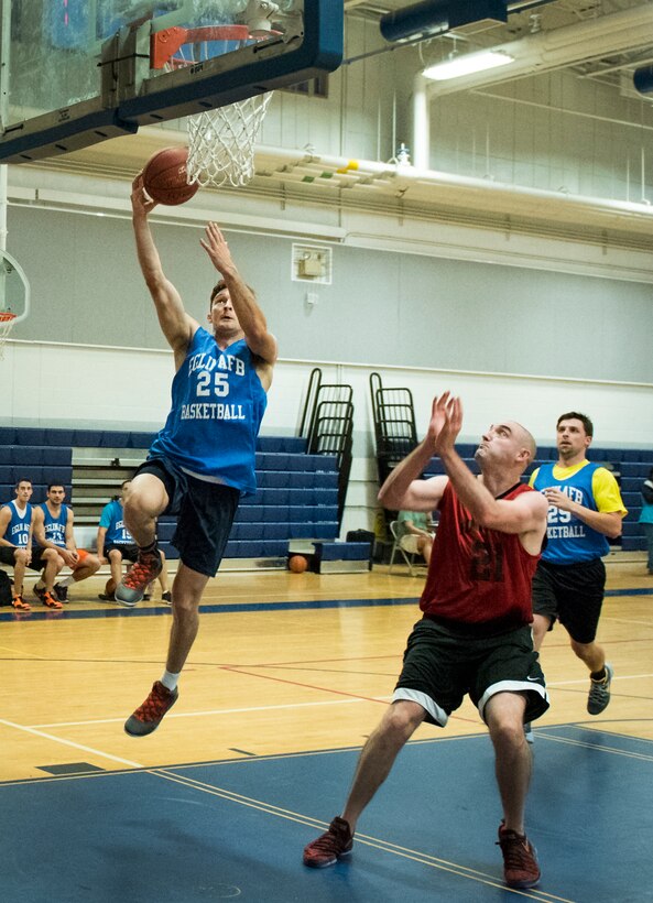 Air Force Research Lab’s Byron Doan drives in for a lay-up during his team’s basketball game Jan. 24 at Eglin Air Force Base Fla.  The 592nd Special Operations Maintenance Squadron team easily controlled the game using their height advantage over the Lab team.  The Duke Field-stationed team rolled to a 2-0 season start with the 41 – 32 victory.  (U.S. Air Force photo/Samuel King Jr.)