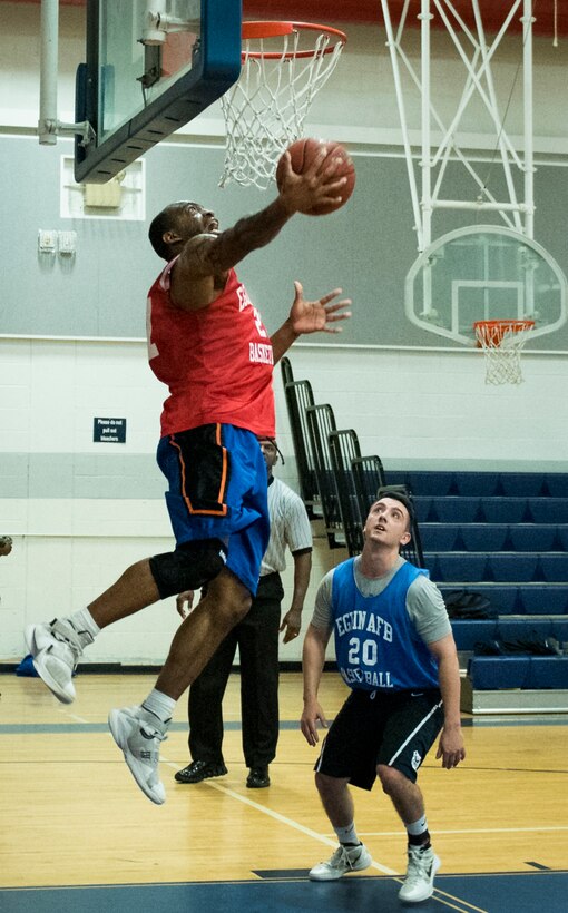 The 592nd Special Operations Maintenance Squadron’s David Freeman goes up for a dunk during his team’s intramural basketball game Jan. 24 at Eglin Air Force Base Fla.  The maintainers easily controlled the game using their height advantage over the Air Force Research Lab team.  The Duke Field-stationed team rolled to a 2-0 season start with the 41 – 32 victory.  (U.S. Air Force photo/Samuel King Jr.)