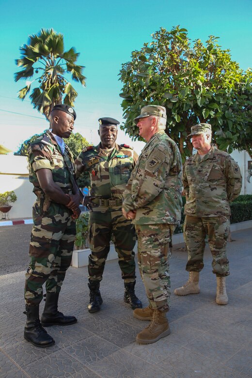 Senegalese Armed Forces junior officer Lt. Dominique Oudiane, Col. Serigne Namadou Sarre, surgeon general of the Senegalese Armed Forces, U.S. Army Reserve Brig. Gen. Kenneth H. Moore, the deputy commanding General for U.S. Army Africa and commander of its Army Reserve Engagement Cell, talk at the Hospital Militaire De Ouakam in Dakar, Senegal prior to the Medical Readiness Training Exercise 17-1 Closing Ceremony, Jan. 25, 2017. MEDRETE is a combined effort between the Senegalese government, U.S. Army Africa, the U.S. Army Reserve 332nd Medical Brigade in Nashville, Tenn., and the Vermont Air National Guard. MEDRETE 17-1 is the first in a series of medical readiness training exercises that U.S. Army Africa is scheduled to facilitate within various countries in Africa, and serves as an opportunity for the partnered militaries to hone and strengthen their general surgery and trauma skills while reinforcing the partnership between the countries. The mutually beneficial exercise brings together Senegalese military and U.S. Army medical professionals to foster cooperation while conducting medical specific tasks.