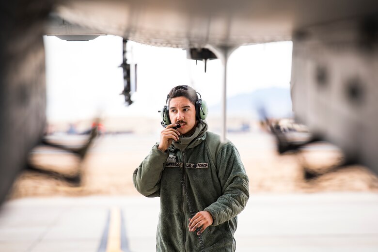 Senior Airman Dalton Torres, 74th Aircraft Maintenance Unit crew chief, communicates with a pilot prior to launching the aircraft during Green Flag-West 17-03, Jan. 23, 2017, at Nellis Air Force Base, Nev. GFW is an air-land integration combat training exercise, which hosted 12 A-10s from Moody Air Force Base, Ga. Accompanying the aircraft were 130 maintenance personnel who worked around the clock to launch 18 sorties per day. (U.S. Air Force photo by Staff Sgt. Ryan Callaghan)