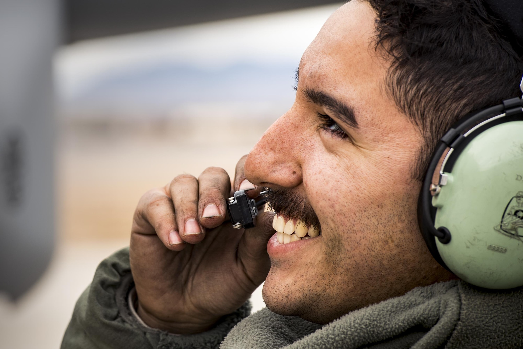 Senior Airman Dalton Torres, 74th Aircraft Maintenance Unit crew chief, communicates with a pilot prior to launching the aircraft during Green Flag-West 17-03, Jan. 23, 2017, at Nellis Air Force Base, Nev. GFW is an air-land integration combat training exercise, which hosted 12 A-10s from Moody Air Force Base, Ga. Accompanying the aircraft were 130 maintenance personnel who worked around the clock to launch 18 sorties per day. (U.S. Air Force photo by Staff Sgt. Ryan Callaghan)
