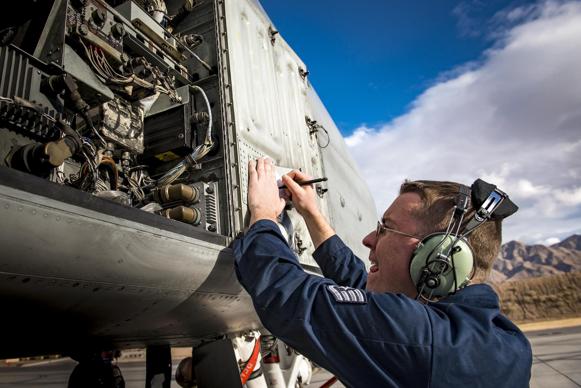 Staff Sgt. Ryan Holovich, 74th Aircraft Maintenance Unit crew chief, conducts a post-flight inspection on an A-10C Thunderbolt II during Green Flag-West 17-03, Jan. 23, 2017, at Nellis Air Force Base, Nev. GFW is an air-land integration combat training exercise, which hosted 12 A-10s from Moody Air Force Base, Ga. Accompanying the aircraft were 130 maintenance personnel who worked around the clock to launch 18 sorties per day. (U.S. Air Force photo by Staff Sgt. Ryan Callaghan)