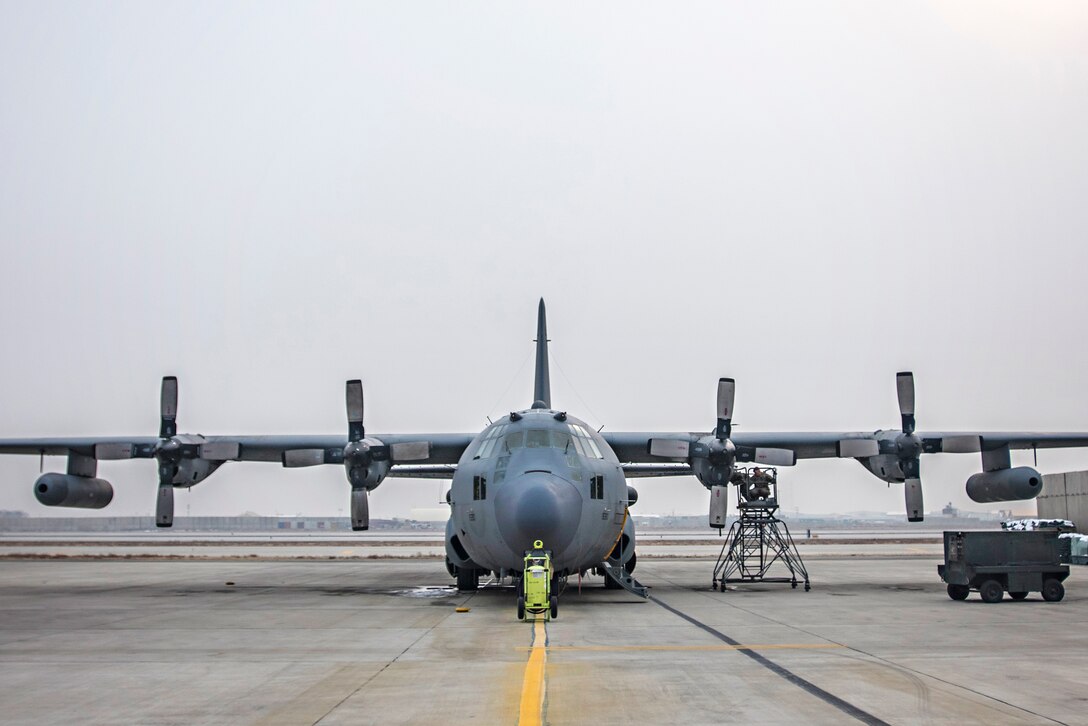 Air Force crew chiefs perform engine maintenance on an EC-130 Compass Call aircraft at Bagram Airfield, Afghanistan, Jan. 18, 2017. Air Force photo by Staff Sgt. Katherine Spessa