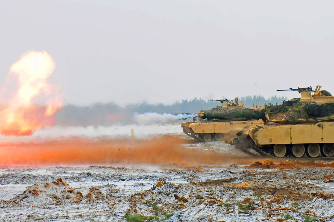 An M1A2 Abrams tank fires a round during gunnery training in Trzebien, Poland, Jan. 26, 2017. The tank belongs to the 1st Battalion, 68th Armor Regiment. Army photo by Staff Sgt. Corinna Baltos