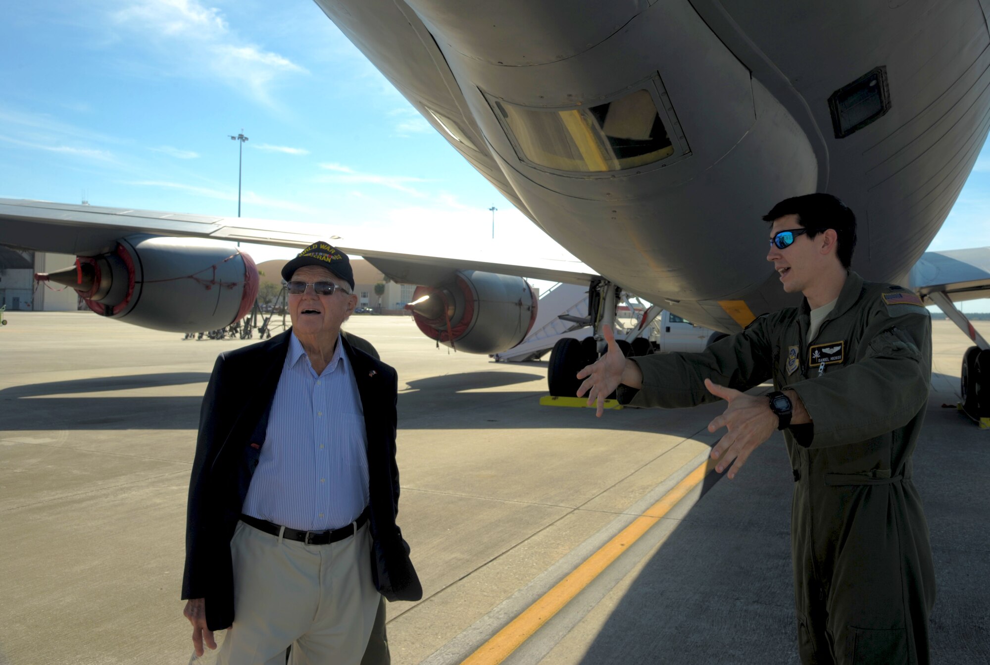 Capt. Daniel Hickox (right), chief of readiness assigned to the 91st Air Refueling Squadron, explains the mission of a KC-135 Stratotanker to Keith Cole, a World War II veteran, at MacDill Air Force Base, Fla., Jan. 18, 2017. Cole was given a tour of the flightline and shown the inside of a KC-135. (U.S. Air Force photo/Airman 1st Class Adam R. Shanks)