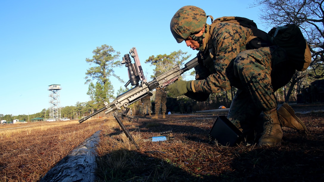 Lance Cpl. Yeison Cuellosuli prepares an M249 Squad Automatic Weapon during weapons systems training conducted by Marine Wing Support Squadron 271, Marine Aircraft Group 14, 2nd Marine Aircraft Wing aboard Marine Corps Base Camp Lejeune, N.C., Jan. 25, 2017. The training allowed Marines with the unit to qualify on the M249 SAW in order to maintain a high level of combat readiness. Marines from a diverse group of job fields participated including bulk fuel, food service and motor transport. Cuellosuli is a food service specialist assigned to MWSS-271. (U.S. Marine Corps photo by Cpl. Mackenzie Gibson/ Released) 