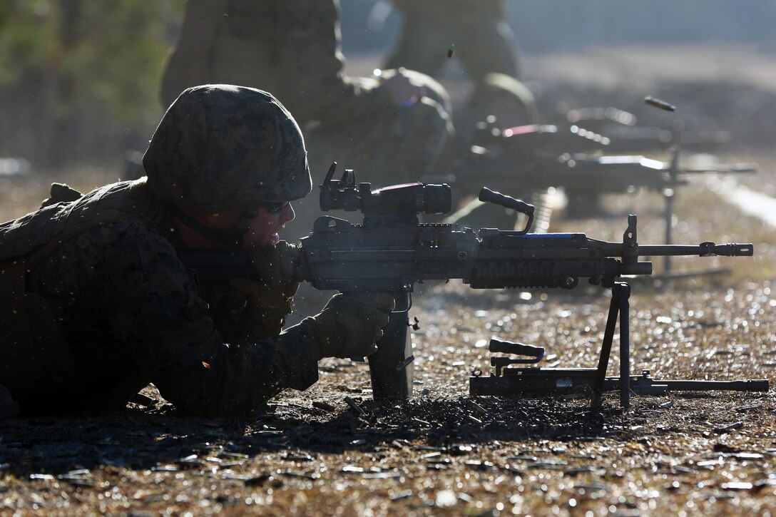 A Marine fires an M249 Squad Automatic Weapon during weapons systems training conducted by Marine Wing Support Squadron 271, Marine Aircraft Group 14, 2nd Marine Aircraft Wing aboard Marine Corps Base Camp Lejeune, N.C., Jan. 25, 2017. By keeping all Marines in the unit qualified on weapons systems, the Marines will be proficient and capable of providing ground security for any fixed-wing components of the aviation combat element. (U.S. Marine Corps photo by Cpl. Mackenzie Gibson/ Released)