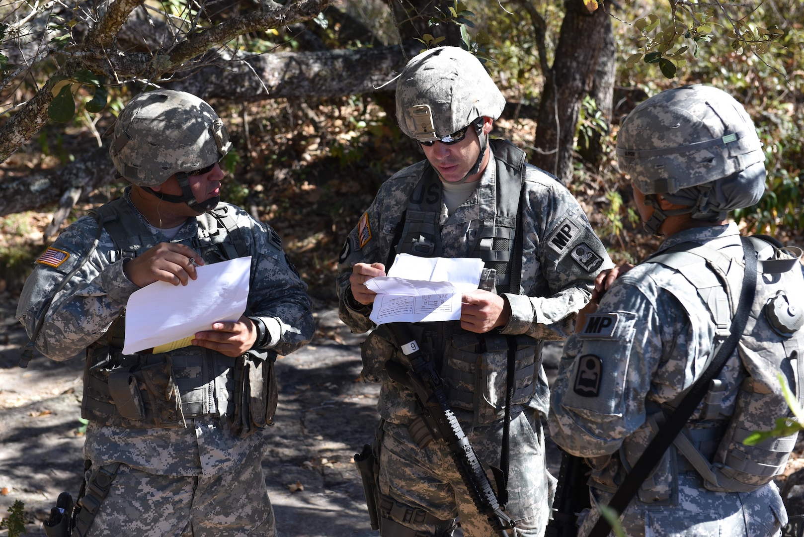 Joint Security Forces personnel review Mechanism, Injury, Signs and Symptoms (MIST) reports prior to their evaluation as part of a Medical Evacuation joint training exercise with the 1st Battalion, 228th Aviation Regiment near Soto Cano Air Base, Honduras, Jan. 18, 2017. JSF soldiers were assigned different scenarios and had to provide an assessment on security as well as patient status for the arrival of flight paramedics.  