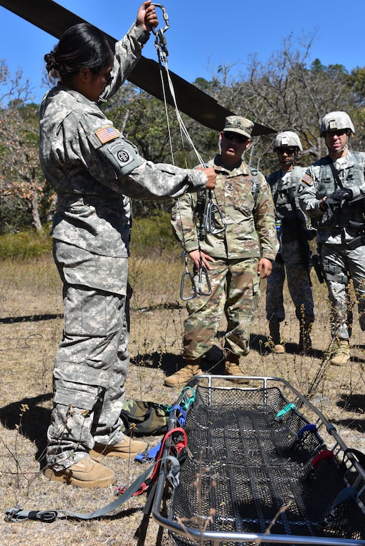 Sgt. Leianne Maugeri, 1st Battalion, 228 Aviation Regiment flight paramedic, explains security measures before executing a medical evacuation rehearsal as part of a joint training exercise between the 1-228 and Joint Security Forces, near Soto Cano Air Base, Honduras, Jan. 18, 2017. The exercise is intended to provide orientation on the extraction and communication procedures for ground forces during a medical evacuation.  