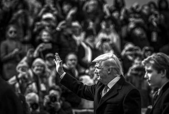 President Donald J. Trump waves at spectators during the 58th presidential inauguration parade in Washington, D.C., Jan. 20, 2017. More than 5,000 military members from across all branches of the armed forces, including Reserve and National Guard components, provided ceremonial support and Defense Support of Civil Authorities during the inaugural period. (Defense Department photo/Air Force Staff Sgt. Marianique Santos)