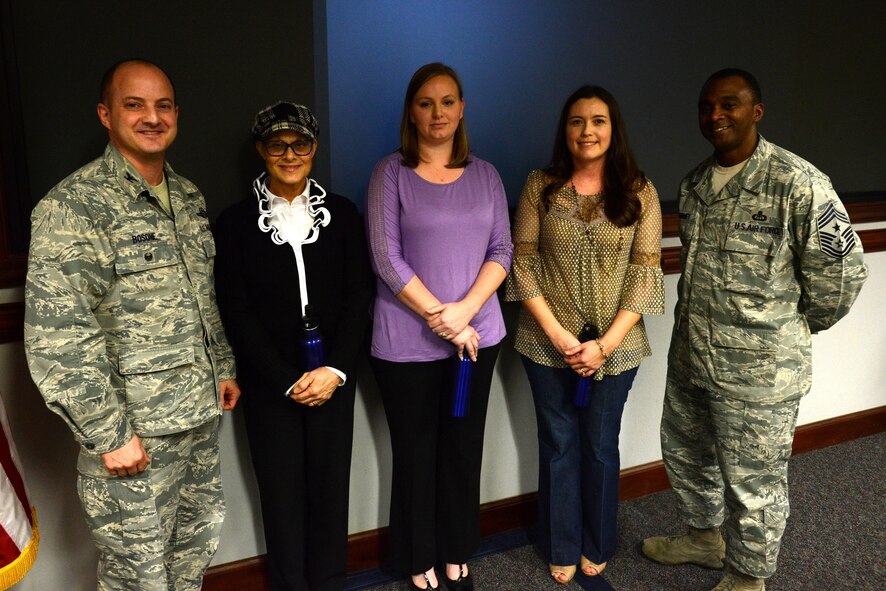 Diane Welch, Carrie Rawls and April Burnette, 20th Civil Engineer Squadron real property office employees, are recognized as the Shaw “Weasels of the Week” by Col. John Bosone, 20th Fighter Wing vice commander, left, and Chief Master Sgt. Christopher McKinney, 20th FW command chief, right, at Shaw Air Force Base, S.C., Jan. 25, 2017. The real property office is in charge of managing 16,000 acres and 935 facilities, actively maintaining a 100 percent inventory compliance rate. (U.S. Air Force photo by Airman 1st Class Kelsey Tucker)