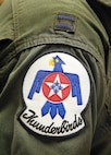 The U.S. Air Force Thunderbirds patch is worn on the flight suit of Capt. Erik "Speedy" Gonsalves, U.S. Air Force Thunderbirds advance pilot/narrator, Jan. 25, 2017, at Dover Air Force Base, Del. Gonsalves, along with Staff Sgt. Todd Hughes, tactical aircraft maintainer, visited Dover AFB to conduct a site survey for Dover's upcoming open house, scheduled for the last weekend in August. (U.S. Air Force photo by Roland Balik)