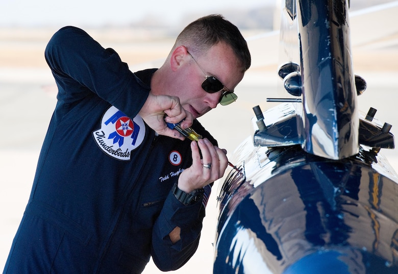 Staff Sgt. Todd Hughes, tactical aircraft maintainer, secures a panel on Thunderbird 8 prior to departing Jan. 25, 2017, at Dover Air Force Base, Del. Hughes prepared the F-16 Fighting Falcon for the next leg of a scheduled nine-base, four-day trip. Kicking off the 2017 show season, the Thunderbirds are scheduled to perform their first public flyover on Feb. 5, 2017, at Super Bowl LI in Houston, Texas. (U.S. Air Force photo by Roland Balik)