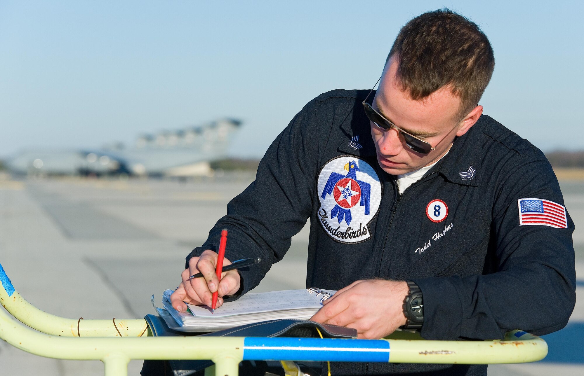 Staff Sgt. Todd Hughes, tactical aircraft maintainer, reviews the aircraft forms for Thunderbird 8, an F-16 Fighting Falcon, prior to departing Jan. 25, 2017, at Dover Air Force Base, Del. Hughes ensured the aircraft was ready for the next scheduled sortie to Pittsburgh, Pa. (U.S. Air Force photo by Roland Balik)