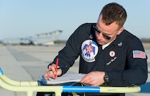 Staff Sgt. Todd Hughes, tactical aircraft maintainer, reviews the aircraft forms for Thunderbird 8, an F-16 Fighting Falcon, prior to departing Jan. 25, 2017, at Dover Air Force Base, Del. Hughes ensured the aircraft was ready for the next scheduled sortie to Pittsburgh, Pa. (U.S. Air Force photo by Roland Balik)