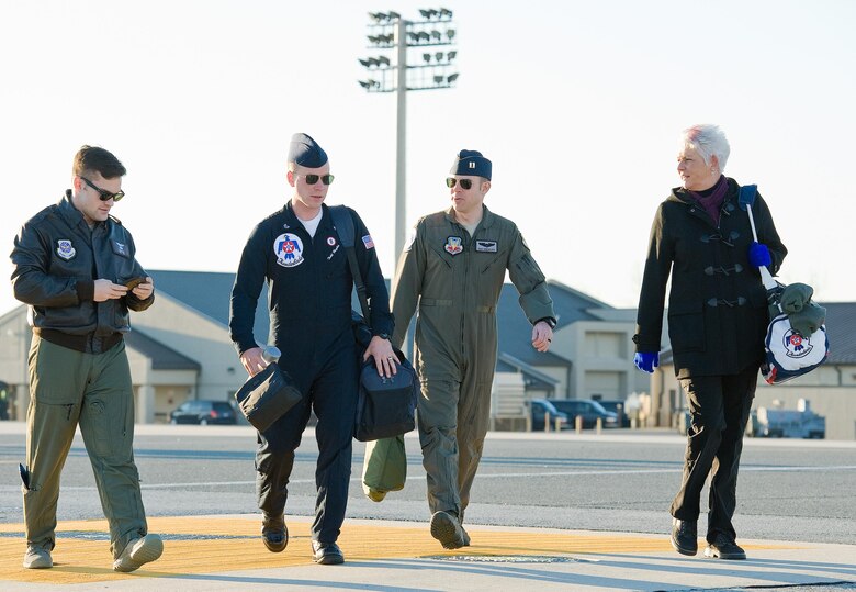 Capt. Michael Knapp, 3rd Airlift Squadron pilot; Staff Sgt. Todd Hughes, tactical aircraft maintainer; Capt. Erik “Speedy” Gonsalves, U.S. Air Force Thunderbirds advance pilot/narrator; and Dawne Nickerson-Banez, 436th Airlift Wing Public Affairs community engagement chief, walk out to Thunderbird 8, an F-16 Fighting Falcon, Jan. 25, 2017, at Dover Air Force Base, Del. Gonsalves and Hughes visited Dover AFB as part of their scheduled nine-base, four-day trip before returning to Nellis Air Force Base, Nev. (U.S. Air Force photo by Roland Balik)