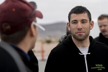 U.S. Air Force Second Lieutenant David Feibus, from Wright-Patterson Air Force Base, Ohio, talks with First Lieutenant Tyler Wallis, from Robins Air Force Base, Ga., prior to the team's initial safety briefing at the Nevada National Security Site, Las Vegas, NV., for the 2016 Air Force Research Laboratory Commanders Challenge Dec. 9, 2016. Teams from six bases were given the challenge of solving issues revolving around drones, and are demonstrating their solutions to judges. (U.S. Air Force photo by Wesley Farnsworth) 