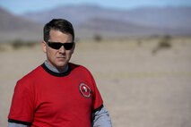 U.S. Capt. John Walton, 2016 Air Force Research Laboratory Commanders Challenge program execution officer, walks across the test range between scenarios at the Nevada National Security Site, Las Vegas, NV., Dec. 13, 2016. The challenge consisted of six teams who were given six-months to develop a complete counter unmanned aerial system to aid in base defense. (U.S. Air Force photo by Wesley Farnsworth)