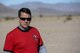 U.S. Capt. John Walton, 2016 Air Force Research Laboratory Commanders Challenge program execution officer, walks across the test range between scenarios at the Nevada National Security Site, Las Vegas, NV., Dec. 13, 2016. The challenge consisted of six teams who were given six-months to develop a complete counter unmanned aerial system to aid in base defense. (U.S. Air Force photo by Wesley Farnsworth)