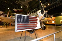 The flag that flew on the USS St. Louis during the Dec. 7, 1941 Japanese surprise attack on Pearl Harbor is on display at the National Museum of the United States Air Force Dec. 7, 2016. The one-time display commemorates the 75th anniversary of the "Day that will live in Infamy," which ushered the United States participation into World War II. (U.S. Air Force photo by Al Bright)