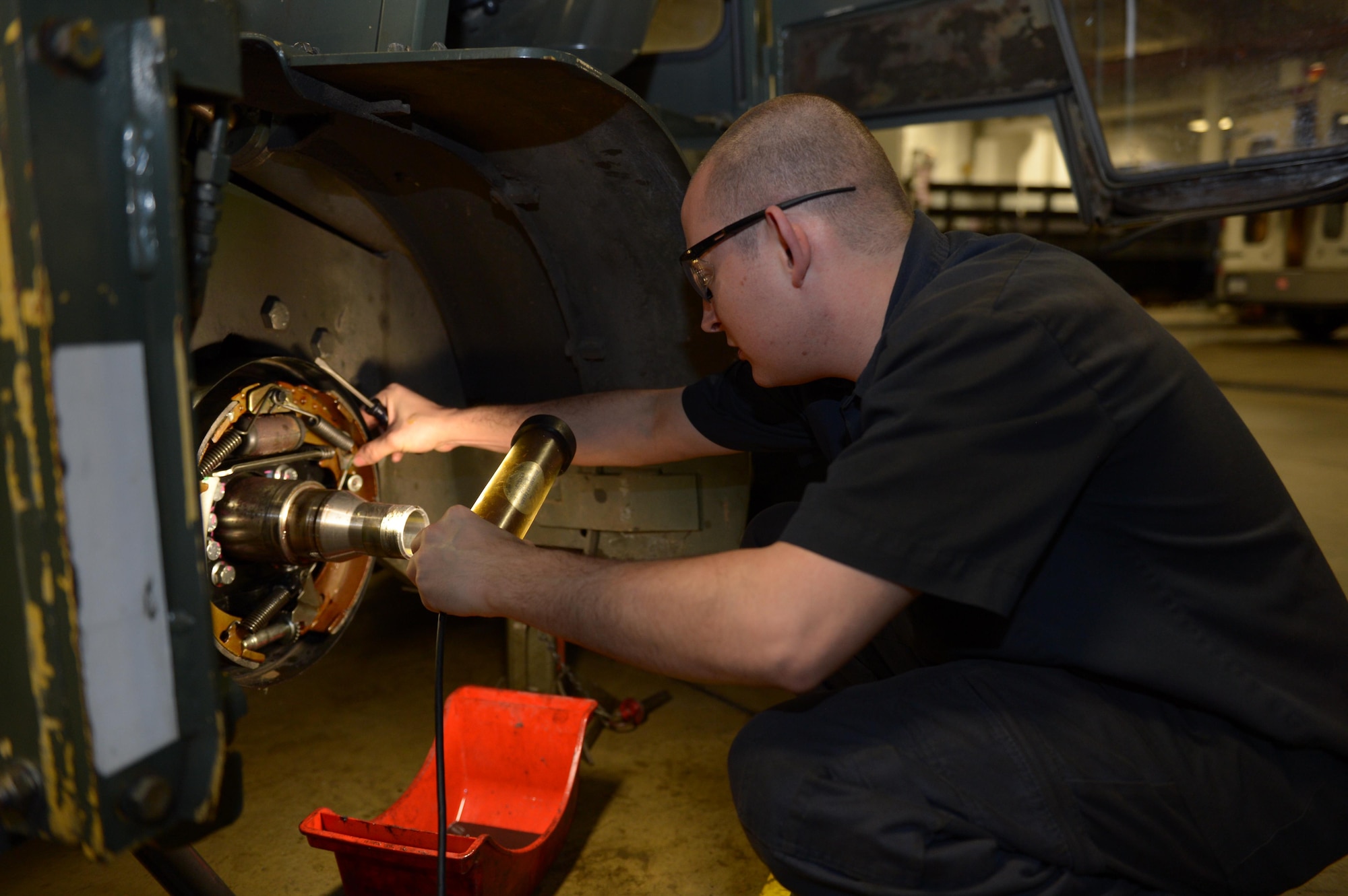 Staff Sgt. Matthew Mason, 2nd Logistics Readiness Squadron vehicle maintenance journeyman, replaces brake shoes on a forklift at Barksdale Air Force Base, La., Jan. 19, 2017. The Airmen of the 2nd LRS have been furthering their education toward Community College of the Air Force degrees by taking classes during their lunch breaks. (U.S. Air Force photo/Senior Airman Curt Beach)