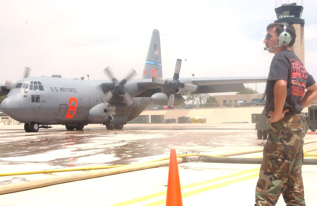 PETERSON AIR FORCE BASE, Colo. – Chief Master Sgt. Mike Sanchez, pictured as a senior master sergeant above, assists with Modular Airborne Fire Fighting System operations during wildland fire fighting activity here in 2002. Sanchez retired in January 2017 after serving 33 years with the Air Force Reserve at Peterson with the 302nd Airlift Wing and 901st Tactical Airlift Group. (Courtesy photo)
