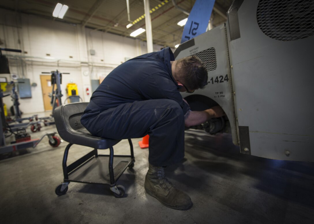 Airman 1st Class Casey Ross, a 49th Maintenance Squadron Aerospace Ground Equipment technician, replaces a rear wheel assembly on an MJ-1B bomb lift, at Holloman Air Force Base, N.M., on Jan. 12, 2017. Holloman’s AGE Airmen perform a wide variety of maintenance duties in support of aircraft maintenance and flying operations. (U.S. Air Force photo by Airman 1st Class Alexis P. Docherty)
