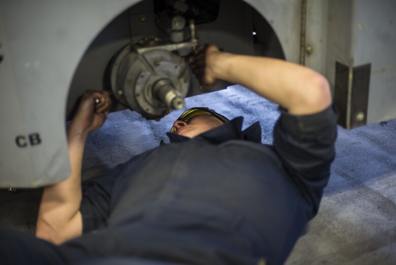 Airman 1st Class Casey Ross, a 49th Maintenance Squadron Aerospace Ground Equipment technician, replaces a rear wheel assembly on an MJ-1B bomb lift, at Holloman Air Force Base, N.M., on Jan. 12, 2017. Holloman’s AGE Airmen perform a wide variety of maintenance duties in support of aircraft maintenance and flying operations. (U.S. Air Force photo by Airman 1st Class Alexis P. Docherty)