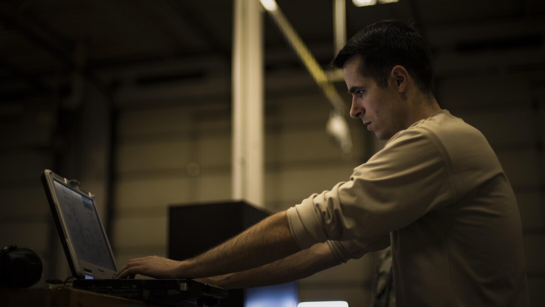 Senior Airman Justin Graham, a 49th Maintenance Squadron Aerospace Ground Equipment technician, reads a technical order prior to performing maintenance on an air conditioning unit at Holloman Air Force Base, N.M., on Jan. 12, 2017. Holloman’s AGE Airmen perform a wide variety of maintenance duties in support of aircraft maintenance and flying operations. (U.S. Air Force photo by Airman 1st Class Alexis P. Docherty)