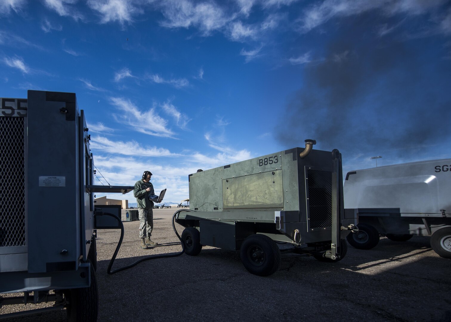 Senior Airman Justin Graham, a 49th Maintenance Squadron Aerospace Ground Equipment technician, reads a technical order while inspecting a piece of AGE at Holloman Air Force Base, N.M., on Jan. 19, 2017. Holloman’s AGE Airmen perform a wide variety of maintenance duties in support of aircraft maintenance and flying operations. (U.S. Air Force photo by Airman 1st Class Alexis P. Docherty)