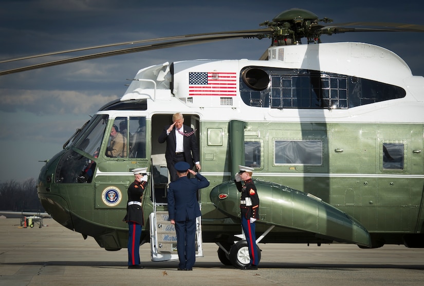 President Donald Trump salutes service members as he exits Marine One at Joint Base Andrews, Md., Jan. 26, 2017. Trump departed for Philadelphia to address the Congressional Grand Old Party Retreat. (U.S. Air Force photo by Senior Airman Mariah Haddenham)