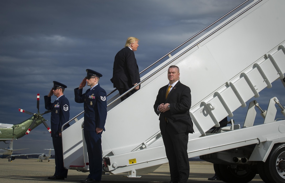 President Donald Trump climbs stairs to Air Force One for the first time at Joint Base Andrews, Md., Jan. 26, 2017. Trump departed for Philadelphia to address the Congressional Grand Old Party Retreat. (U.S. Air Force photo by Senior Airman Mariah Haddenham)