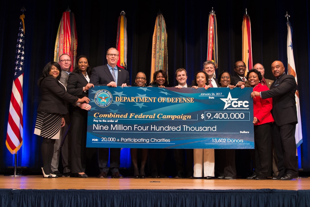 Deputy Defense Secretary Bob Work poses for a photo holding the check reflecting the total collected in the Defense Department Combined Federal Campaign during an awards ceremony at the Pentagon, Jan. 26, 2017. DoD photo by Army Sgt. Amber I. Smith