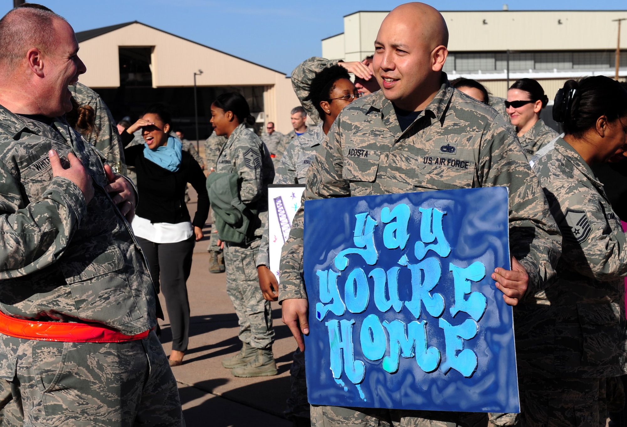 Dyess Airmen, friends and family members wait near the flightline in anticipation of returning deployers at Dyess Air Force Base, Texas, Jan. 20, 2017. Airmen assigned to the 40th Airlift Squadron, 317th Aircraft Maintenance Squadron, 317th Maintenance Squadron, 317th Operations Support Squadron, 7th Equipment Maintenance Squadron and 7th Logistics Readiness Squadron were part of those deployed. 