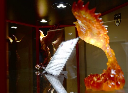 Items representing the 43rd Flying Training Squadron Firebirds sit in a case Jan. 25, 2017, on Columbus Air Force Base, Mississippi. The 43rd FTS does not have a traditional heritage room and instead houses its history in the entrance to the command section. (U.S. Air Force photo by Senior Airman John Day)
