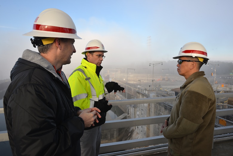 Tommie Long and Adam Walker, Nashville District project manager explain work at the project site to Brig. Gen. Mark Toy, U.S. Army Corps of Engineers Great Lakes and Ohio River Division commander at Chickamauga Lock in Chattanooga, Tenn., Jan. 25, 2017. 