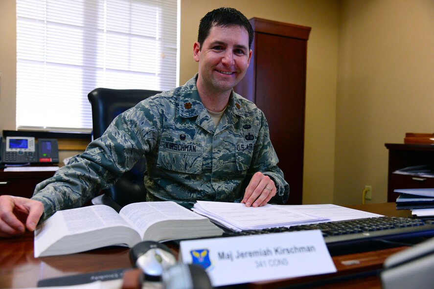 Maj. Jeremiah Kirschman, 341st Contracting Squadron commander, sits at his desk Dec. 21, 2016, at Malmstrom Air Force Base, Mont. Kirschman received the 2016 Air Force Global Strike Command Outstanding Contracting Officer Award in the field grade officer category. (U.S. Air Force photo/Airman 1st Class Magen M. Reeves)