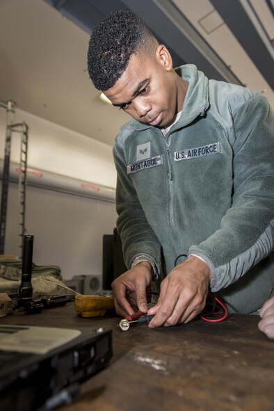 U.S. Air Force Senior Airman Shaquille Montague, a firefighter with the 35th Civil Engineer Squadron, charges a diode for a M32A-60A gas turbine generator during Misawa’s first-ever career field exchange and shadow program at Misawa Air Base, Japan, Jan. 26, 2017. The generator is a 35th Maintenance Squadron aerospace ground equipment flight asset used to troubleshoot F-16 Fighting Falcons prior to takeoff. Montague joined five other Airmen who took part in Misawa’s first-ever career field exchange and shadow program. (U.S. Air Force photo by Staff Sgt. Benjamin W. Stratton)