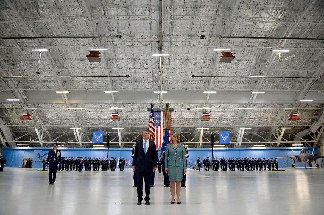 Secretary of Defense Ash Carter and Secretary of the Air Force Deborah Lee James listen to the citation for her Distinguished Public Service award during James' farewell ceremony at Joint Base Andrews, Md., Jan. 11, 2017. James took office as the 23rd secretary of the Air Force in December 2013. The USAF Band and Honor Guard supporting in the background. (U.S. Air Force photo/Tech. Sgt. Joshua L. DeMotts/released) 