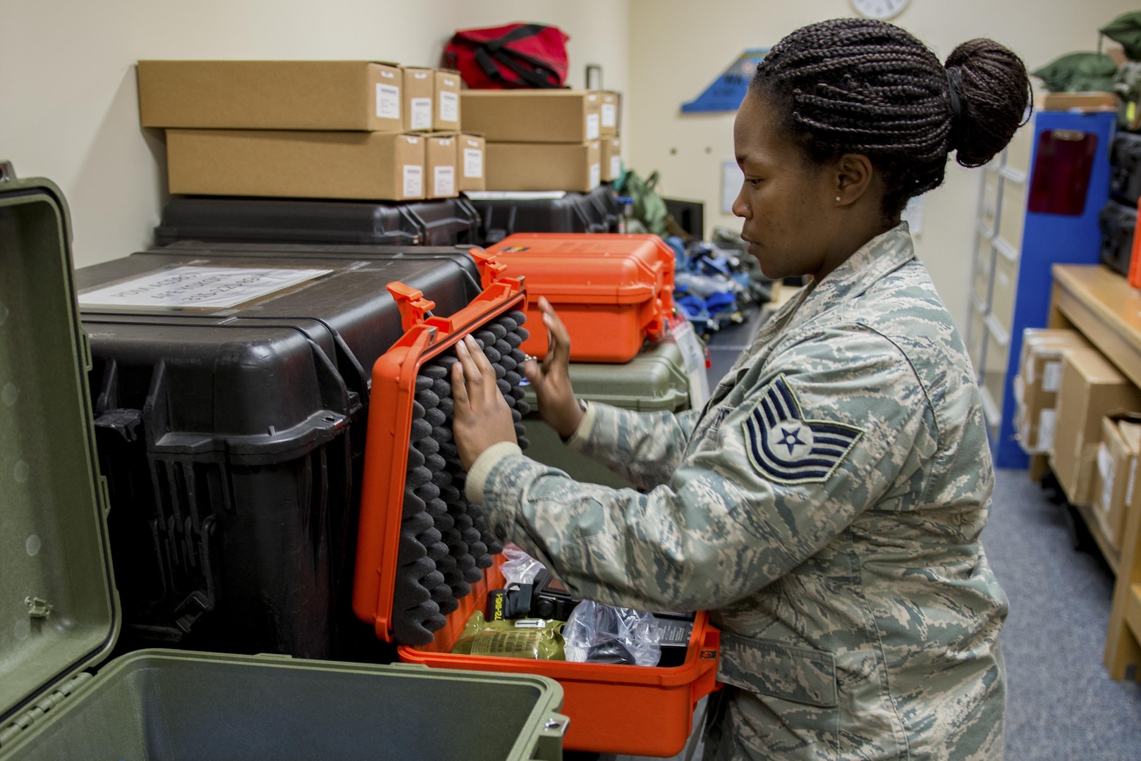 Tech. Sgt. Shakuntala M. Willis, 374th Operations Support Squadron Aircrew Flight Equipment flight NCO in charge of the C-130J transition, inventories a new aircrew survival equipment kit Jan. 20, 2017, at Yokota Air Base, Japan. For the new C-130J Super Hercules aircrafts scheduled to arrive at Yokota in 2017, brand-new aircrew life-support and survival equipment will also be supplied by the 374th AFE flight. (U.S. Air Force photo by Airman 1st Class Donald Hudson)