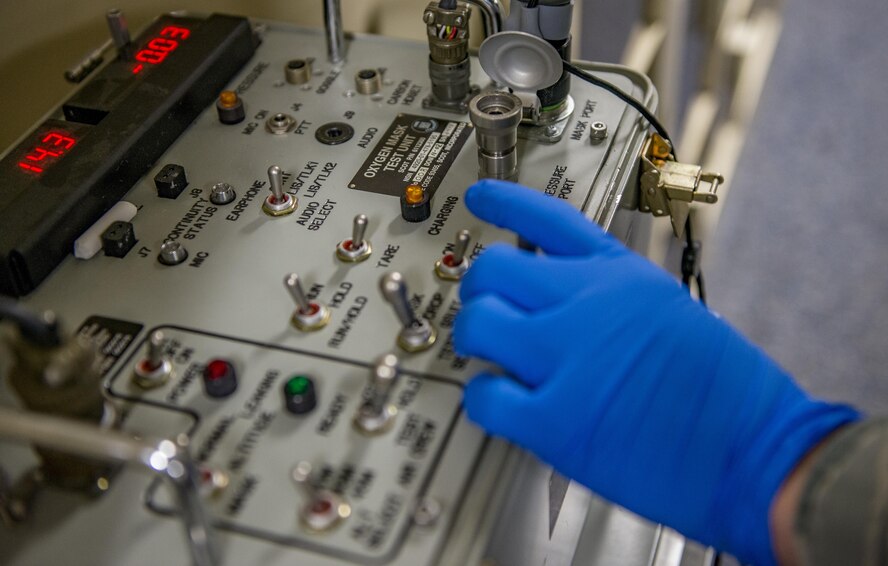 Senior Airman Kenny Batallas, 374th Operations Support Squadron Aircrew Flight Equipment flight technician, prepares to perform an operations check on a new quick-dawn oxygen mask Jan. 25, 2017, at Yokota Air Base, Japan. Operation checks are performed by the 374th AFE flight regularly on every piece of aircrew life-support and survival item to ensure everything functions as required. (U.S. Air Force photo by Airman 1st Class Donald Hudson)