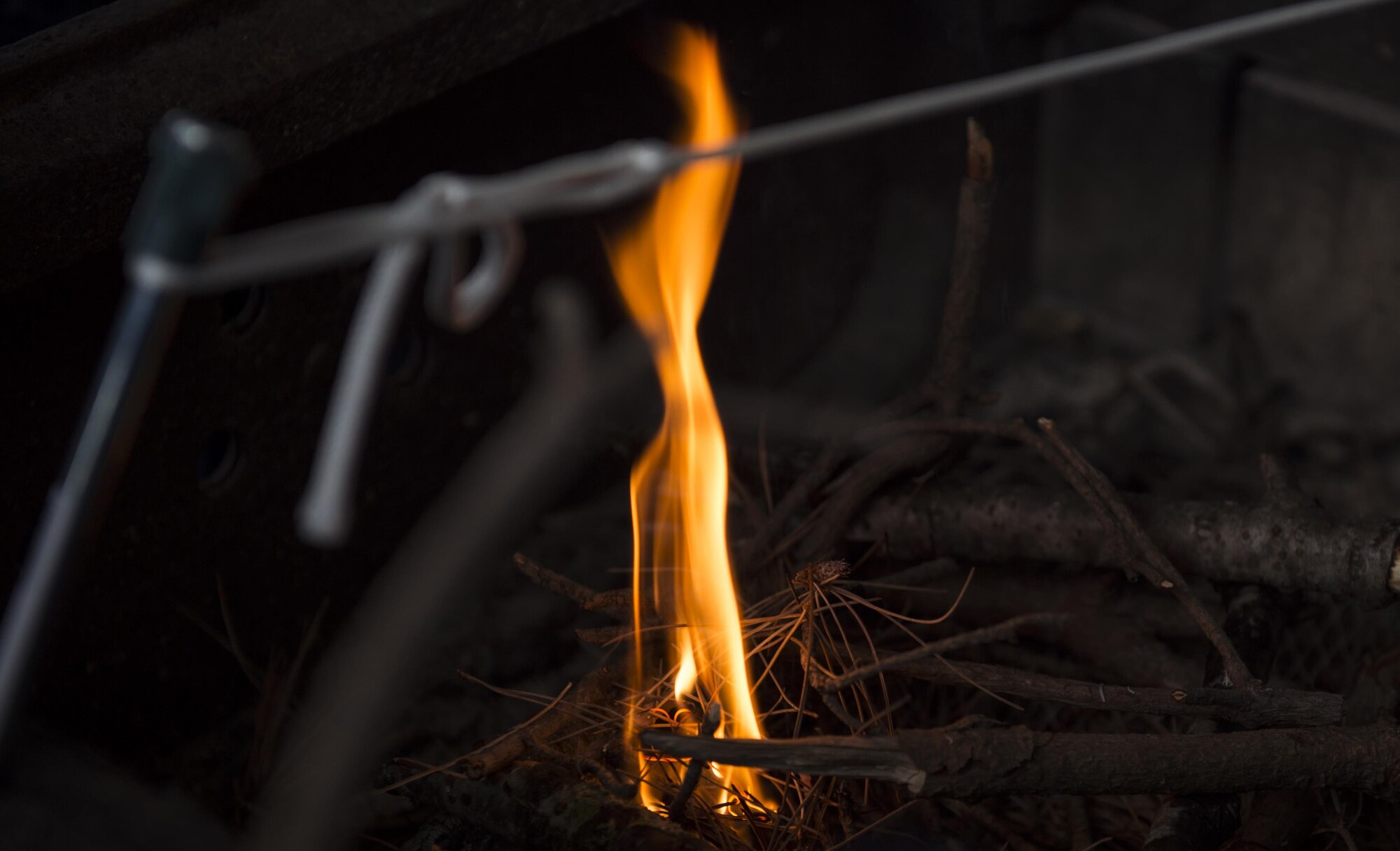 Boyscouts learn to start a fire during the Klondike Derby at Misawa Air Base, Japan, Jan. 20, 2017. The boys had to gather tinder and kindling to start and maintain the flame. The Klondike Derby taught tent setup, fire buring, first aid and other surival skills to help overcome the dangers of a cold environment.  (U.S. Air Force photo by Tech. Sgt. Araceli Alarcon)