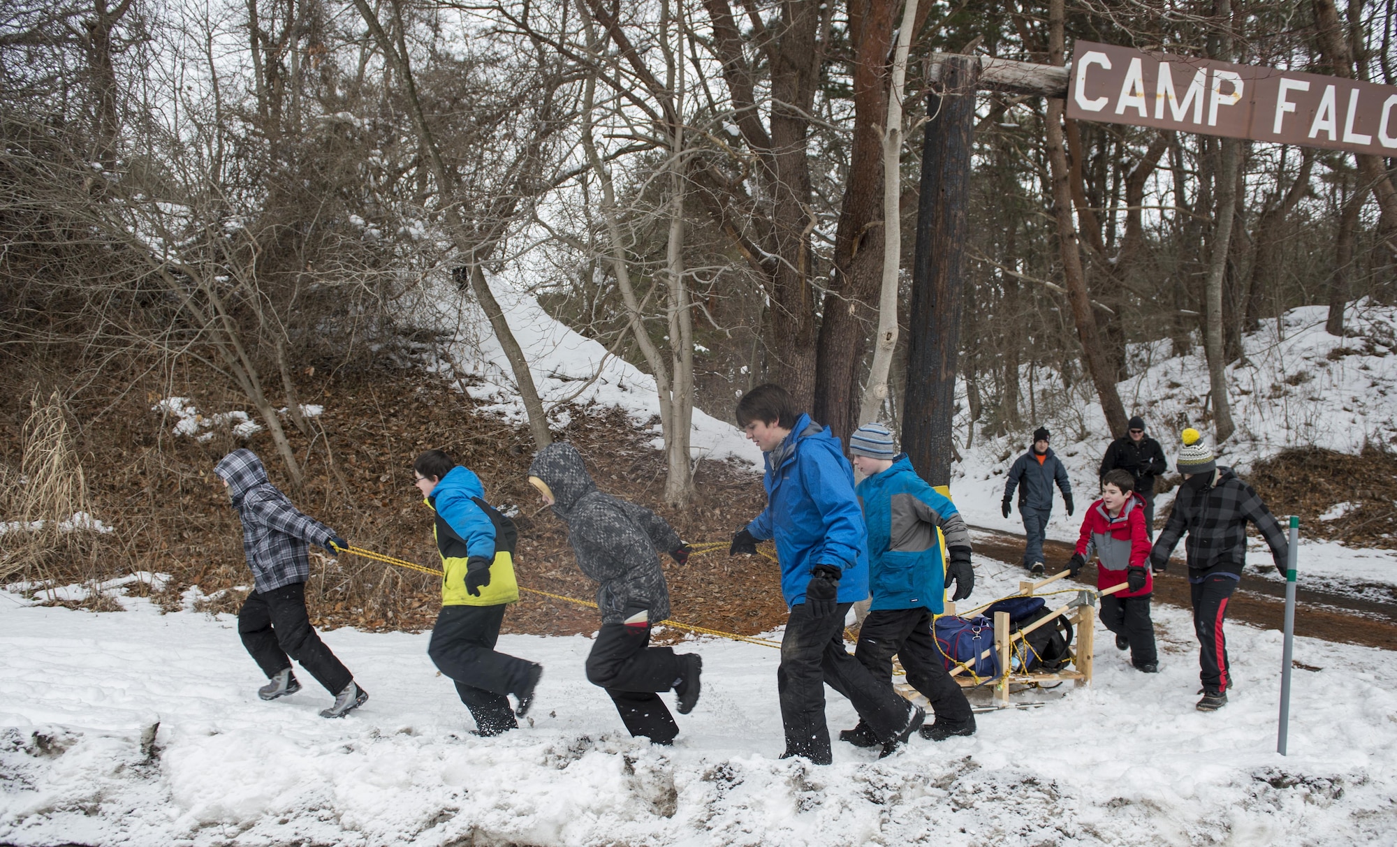 Deacon Patrol from Troop 9 pull their sled to the first station during the Klondike Derby at Misawa Air Base, Japan, Jan. 21, 2017. Before the Klondike Derby, the boys had to build their own sled and pull it around to every station. The Klondike Derby taught tent setup, fire buring, first aid and other surival skills to help overcome the dangers of a cold environment. (U.S. Air Force photo by Tech. Sgt. Araceli Alarcon)