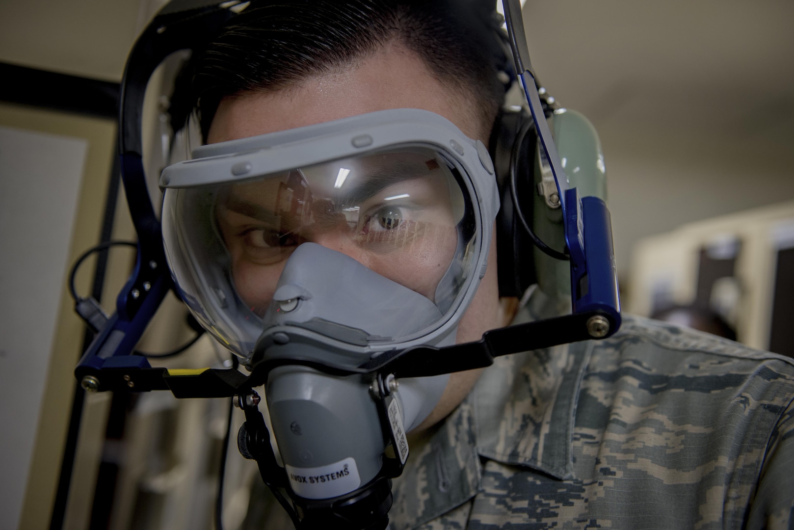 Senior Airman Kenny Batallas, 374th Operations Support Squadron Aircrew Flight Equipment flight technician, performs an operations check on a new quick-dawn oxygen mask Jan. 25, 2017, at Yokota Air Base, Japan. Operations checks are performed by the 374th AFE flight regularly on every piece of aircrew life-support and survival item to ensure everything functions as required. (U.S. Air Force photo by Airman 1st Class Donald Hudson)