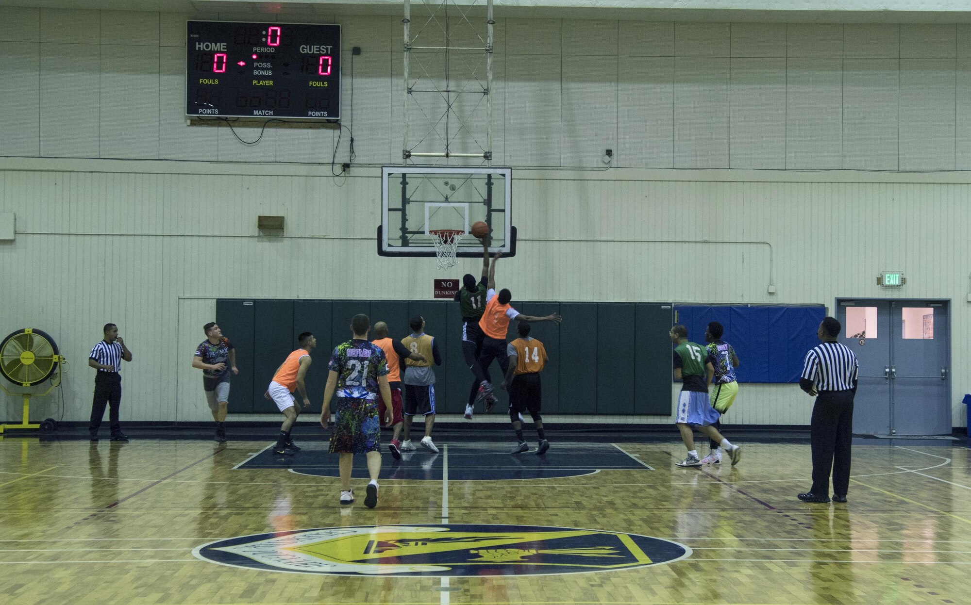 Jarvis Hodges, 374th Maintenance Squadron, lays the ball up during the second half of the intramural basketball game at Yokota Air Base, Japan, Jan. 24, 2017. Hodges scored two of his eight points for the game on this play. (U.S. Air Force photo by Staff Sgt. David Owsianka)