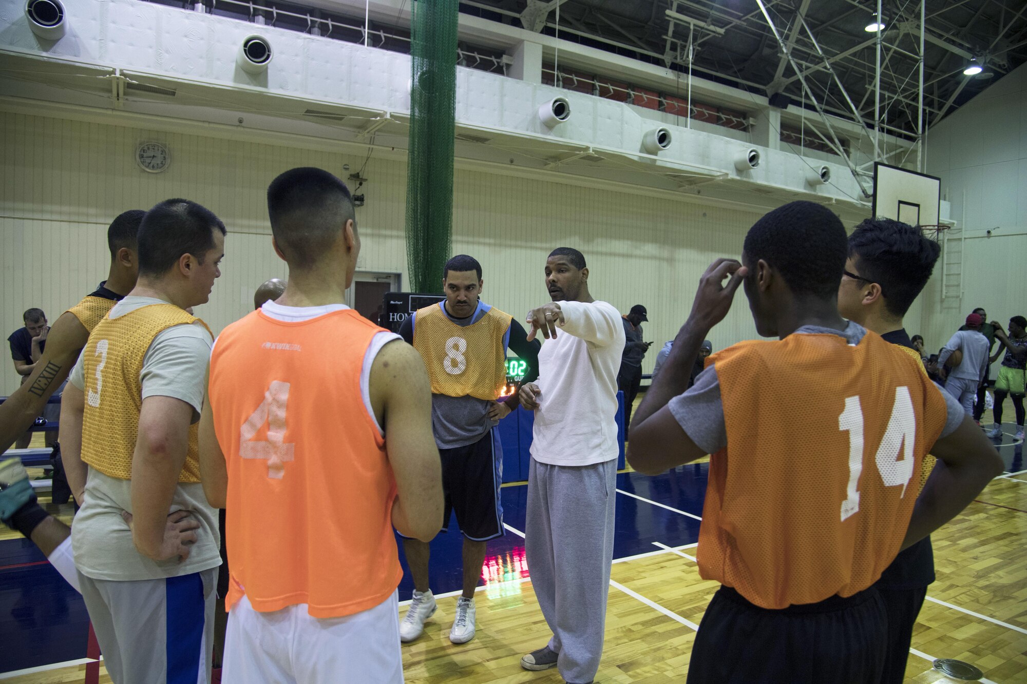 Kameron Beckett, 374th Communications Squadron, talks to the team during a timeout in the second half of the intramural basketball game at Yokota Air Base, Japan, Jan. 24, 2017. The 374 CS team was able to cut the 374th Maintenance Squadron team’s lead to three points in the second half, but were unable to take the lead or win. (U.S. Air Force photo by Staff Sgt. David Owsianka)