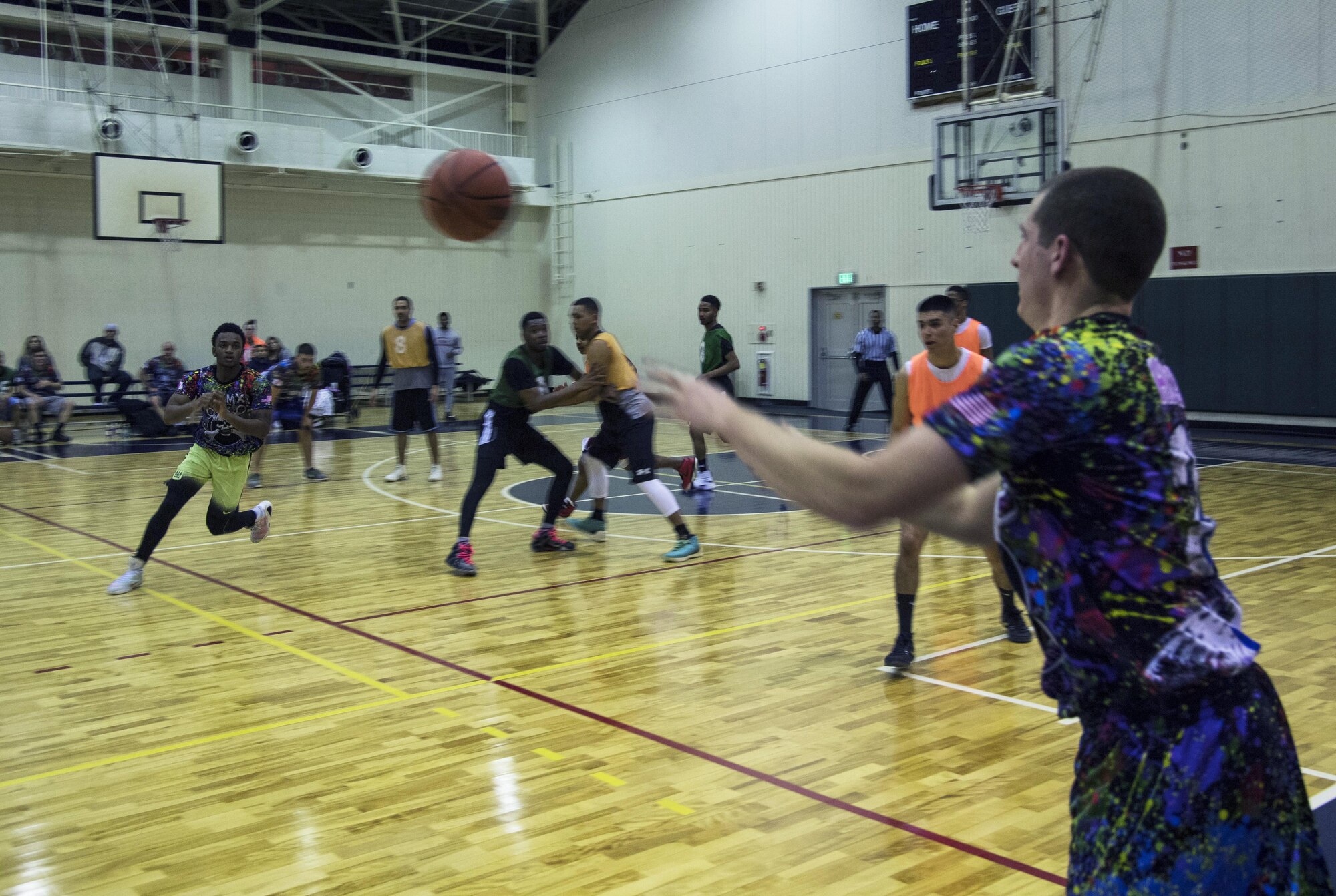 Matthew Hepler passes the ball to Dalvin James, both from the 374th Maintenance Squadron, during the second half of the intramural basketball game at Yokota Air Base, Japan, Jan. 24, 2017. The 374 MXS team won the game 46-40 giving them a 1-0 record for the season. (U.S. Air Force photo by Staff Sgt. David Owsianka)